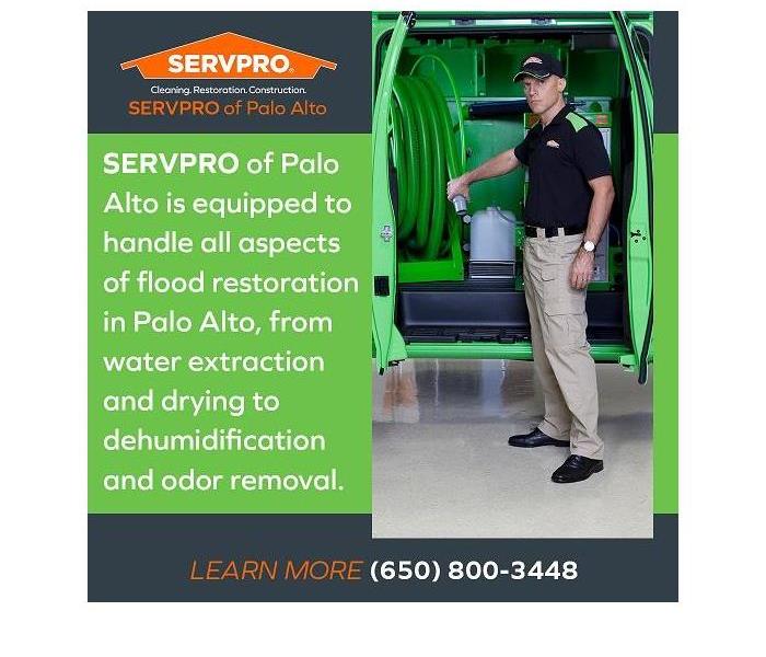 SERVPRO technician pulling out a hosepipe from the restoration truck