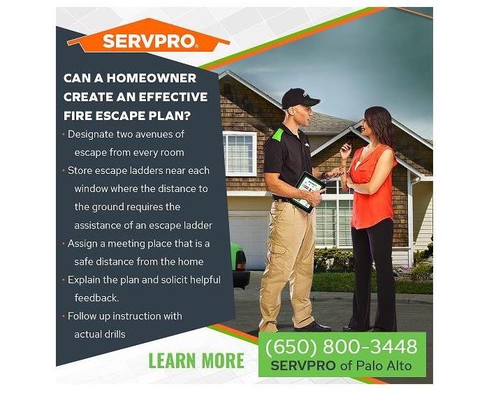 A SERVPRO technician talking with a client in front of their home